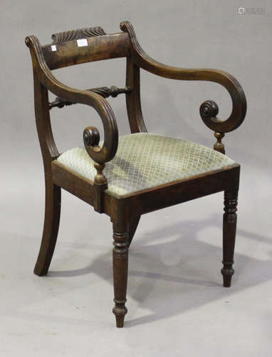 A George IV mahogany scroll arm elbow chair, on ring turned legs, height 80cm, width 56cm.Buyer’s