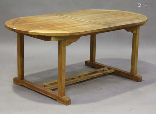 A late 20th century teak extending garden table by Westminster, height 74cm, length 181cm, depth