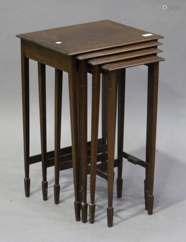 An Edwardian mahogany nest of quartetto occasional tables, crossbanded in satinwood, on square