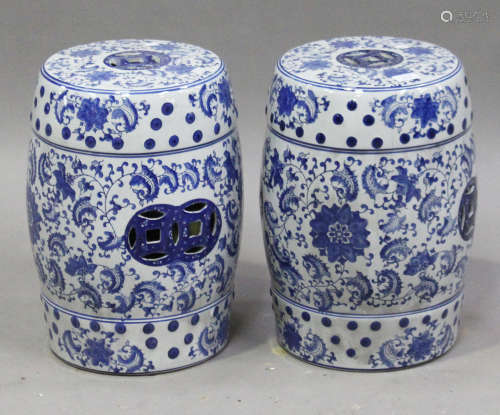 A pair of modern Chinese blue and white porcelain barrel shaped garden seats, decorated with overall