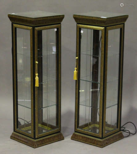A pair of modern burr walnut-effect and gilt decorated upright pedestal display cabinets, each