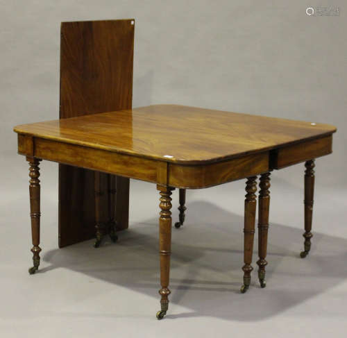 A late George III mahogany dining table with single extra leaf, on ring turned tapering legs