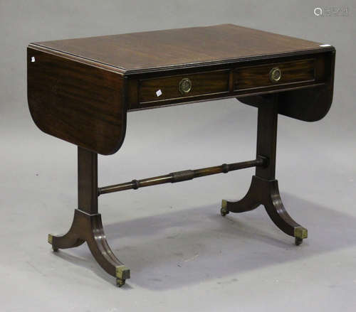 A 20th century Regency style mahogany sofa table, fitted with two frieze drawers, on sabre legs,