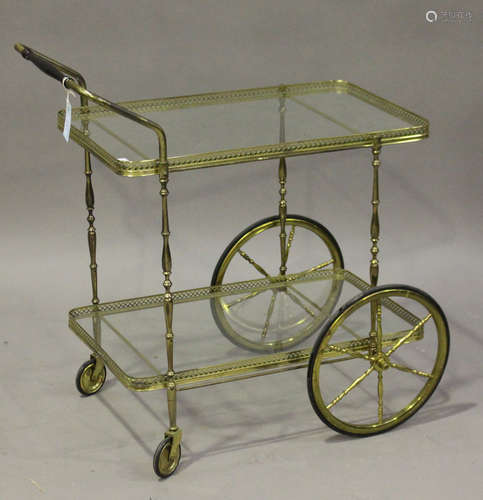 A 20th century gilt brass and glass two-tier hostess trolley, height 78cm, length 80cm.Buyer’s