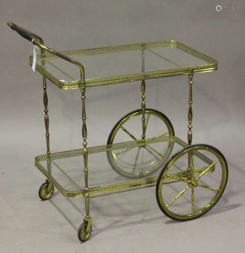 A 20th century gilt brass and glass two-tier hostess trolley, height 78cm, length 80cm.Buyer’s