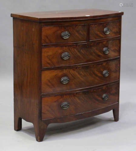 A Regency mahogany bowfront chest of two short and three long drawers, on bracket feet, height