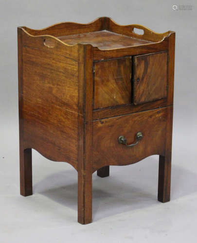 A George III mahogany night table with gallery top, fitted with a cupboard above a pot drawer,