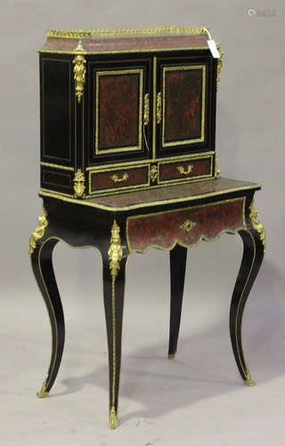 A late 19th century ebonized and boulle work bonheur-du-jour, decorated with overall panels of red