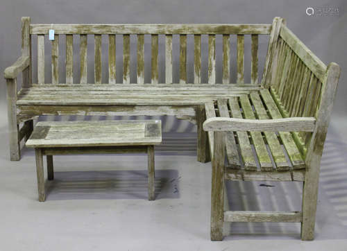 A 20th century slatted teak garden corner bench, height 90cm, width 186cm, and a matching table,