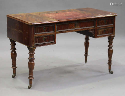 A Victorian mahogany writing table, the hinged writing surface above five drawers, on turned legs,