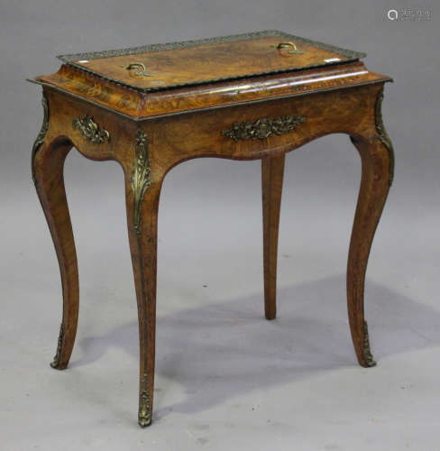 A late Victorian Rococo Revival burr walnut and gilt metal mounted jardinière table, the removable