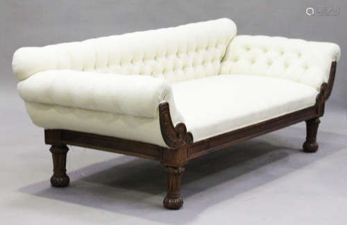 A Regency rosewood low back settee, upholstered in cream buttoned damask, raised on turned and tulip