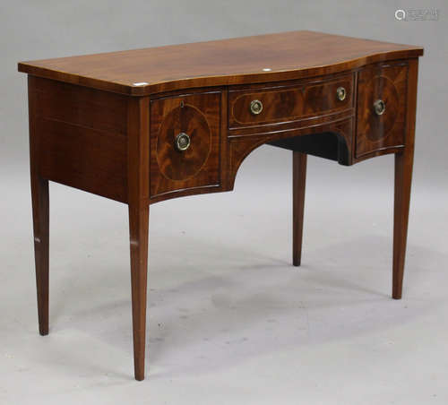 An early 20th century George III style serpentine fronted mahogany sideboard with inlaid decoration,