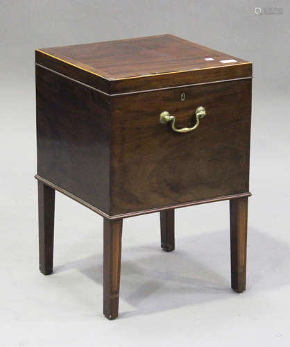 A George III mahogany wine cooler with boxwood stringing, the hinged lid raised on square tapering