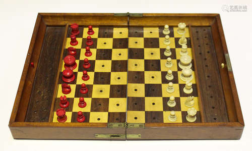 A late 19th century Jaques 'In Statu Quo' patent mahogany cased travelling chess set, the interior