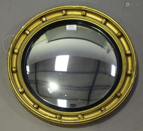 A 20th century Regency style gilt convex wall mirror, diameter 47cm.Buyer’s Premium 29.4% (including