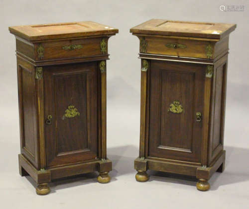 A pair of 20th century French Empire style mahogany side cabinets with gilt metal mounts, each