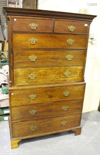 A George III mahogany chest-on-chest, the dentil moulded pediment above two short and six long