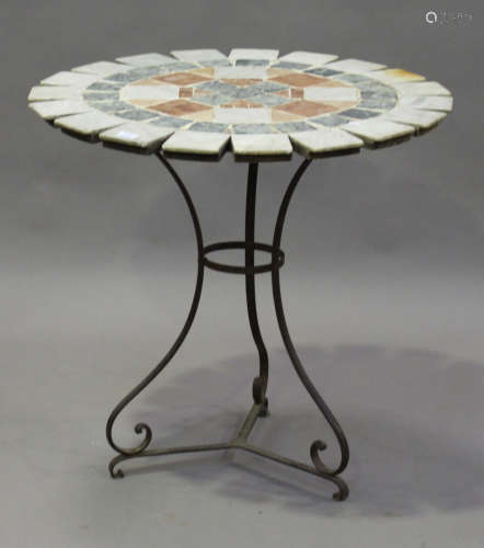 A late 20th century French circular garden table with sectional marble top, raised on a wrought
