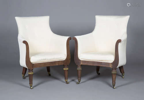 A pair of Regency mahogany framed tub back armchairs, upholstered in cream satin, on gilt metal