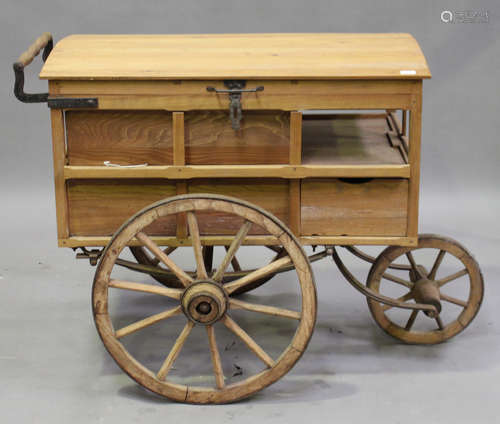 An early 20th century and later French street vendor's cart with domed hinged lid and three metal