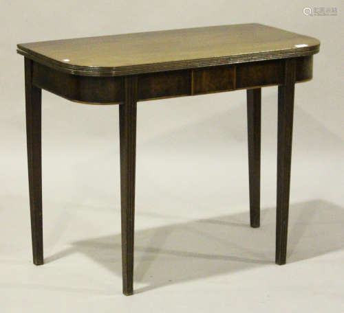 A George III mahogany rectangular fold-over tea table, on reeded tapering legs, height 72cm, width