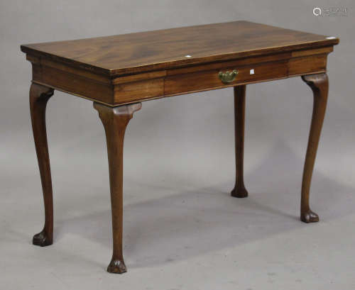 An 18th century mahogany serving table, fitted with a single cushion frieze drawer, on cabriole legs