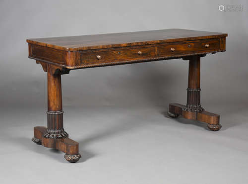 A Regency rosewood rectangular library table, in the manner of Gillows, fitted with two frieze