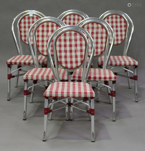 A set of six late 20th century French aluminium café chairs with woven seats.Buyer’s Premium 29.