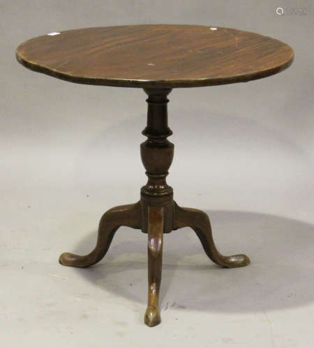 A 19th century mahogany circular tip-top wine table, raised on a turned column and tripod cabriole