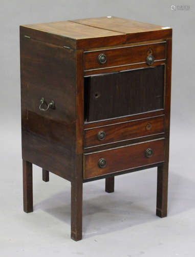 A George III mahogany gentleman's wash stand, the hinged top above three drawers and a cupboard,