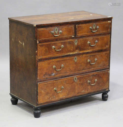 A 19th century George I style walnut chest of two short and three long drawers, on turned feet,