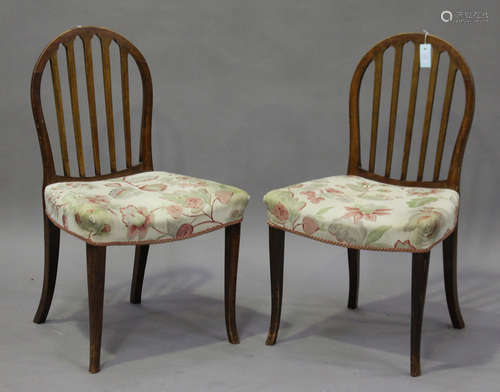 A set of six late 19th/early 20th century Continental stained beech comb back dining chairs, the