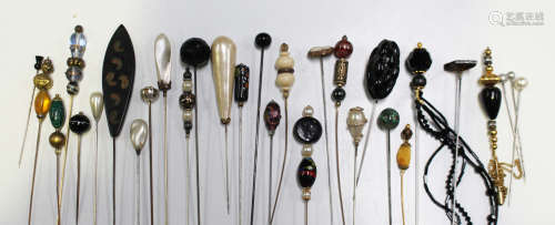 A collection of 20th century stick and hat pins of various designs.Buyer’s Premium 29.4% (