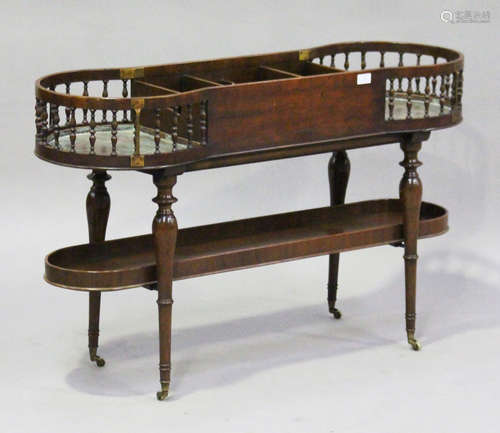 A 20th century mahogany butler's stand, in the manner of Gillows, the central cutlery tray flanked