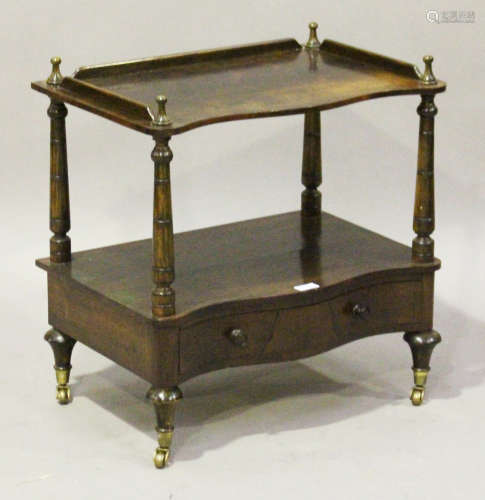 A mid-Victorian rosewood two-tier whatnot, the two serpentine levels on turned supports, the base