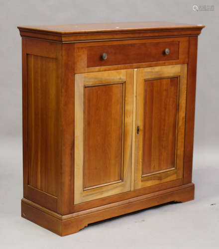 A modern French cherry 'Grange' cabinet with single drawer above a cupboard enclosed by two doors,