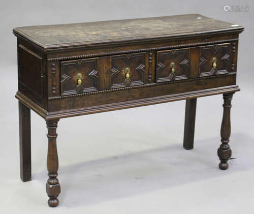 A 19th century Jacobean Revival oak dresser base, the two frieze drawers with applied geometric