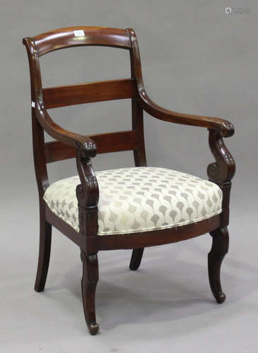 A 19th century French mahogany bar back elbow chair with scroll arms, the overstuffed seat raised on