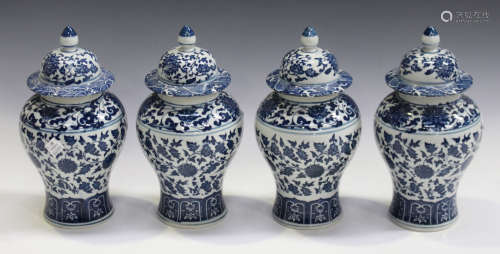 A set of four modern Chinese blue and white porcelain vases and covers of baluster form, height 23.