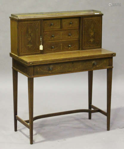 An Edwardian Neoclassical Revival mahogany bonheur-du-jour with inlaid decoration, the top fitted