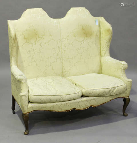 A 20th century Queen Anne style two-seat sofa with double-arched back, on cabriole legs, height