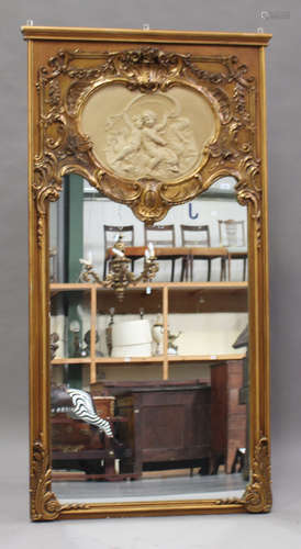 An early 20th century Rococo Revival gilt painted pier mirror with shell and scroll decoration,