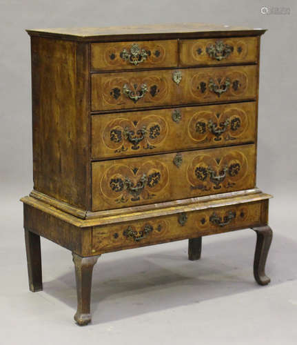 A George I walnut and marquetry inlaid chest-on-stand, the top profusely inlaid with a central urn