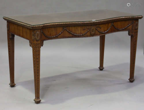 An early 20th century Neoclassical Revival mahogany serpentine fronted serving table, the frieze