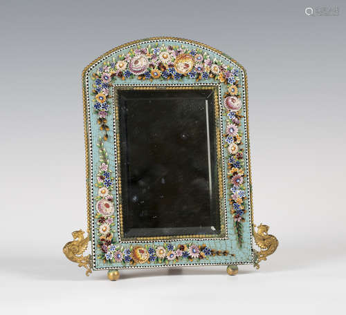 A late 19th century Italian gilt metal and micro-mosaic dressing table mirror, the arched frame with