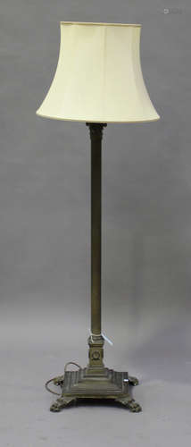 An Edwardian brass Corinthian column lamp-standard, on a stepped base, height 152cm.Buyer’s