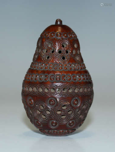 A 19th century carved and pierced coquilla nut box of pear form, length 5.3cm.Buyer’s Premium 29.