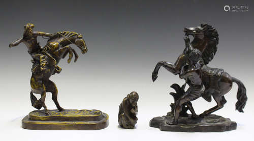 After Guillaume Coustou - an early 20th century brown patinated cast bronze model of a Marly horse