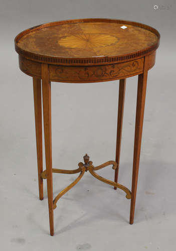 An Edwardian satinwood and foliate inlaid oval table by Edwards & Roberts, raised on square tapering